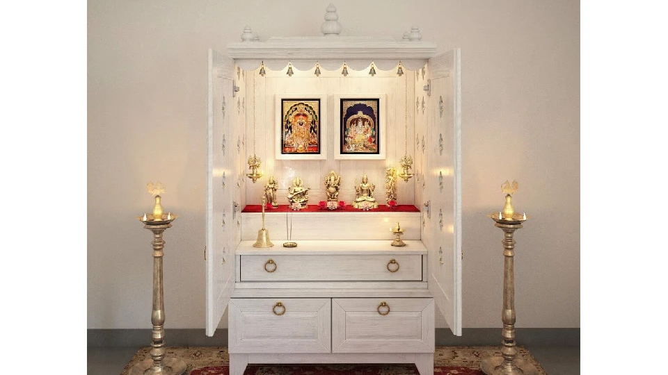 white prayer unit with idols, candles and storage