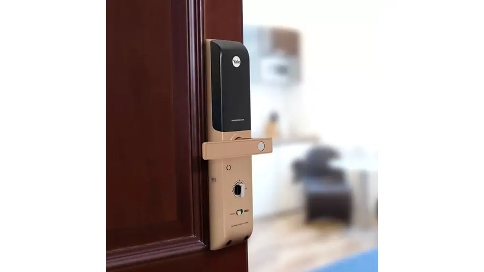 yale roller lock on a wooden door