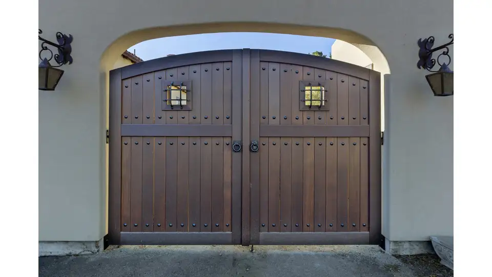 a wooden swing door with elevated harwdare design