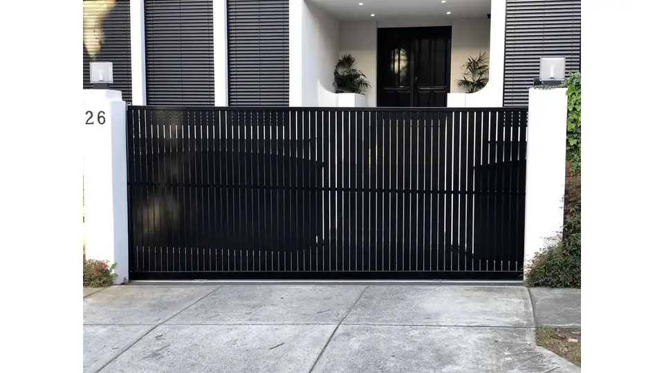 Monochromatic sliding modern steel/iron gate in black