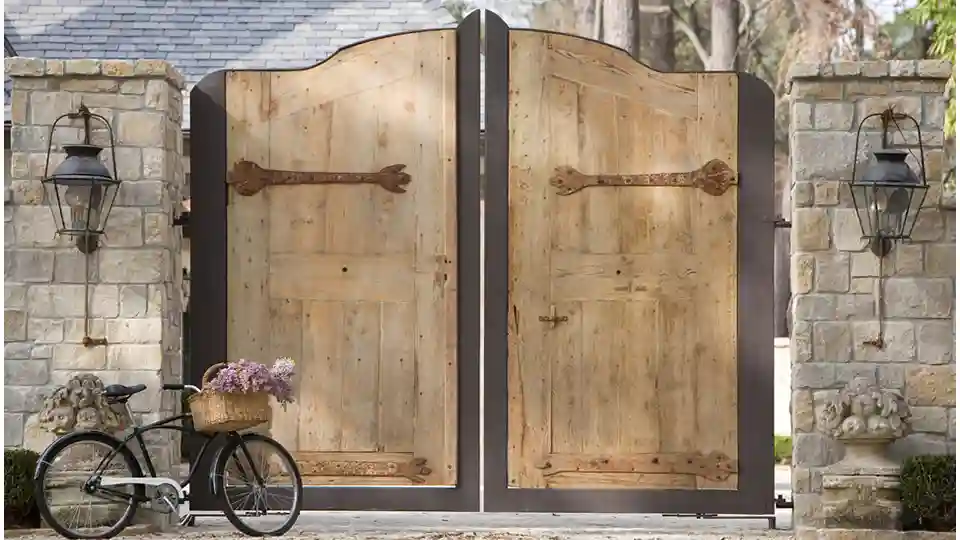 Wooden rustic gate with a cycle parked infront of it