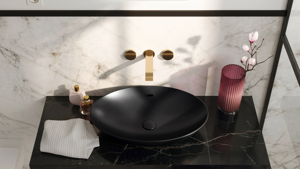 black washbasin with gold finish faucet in a Villeroy & Boch luxury bathroom