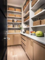 a wooden finish walk in pantry unit