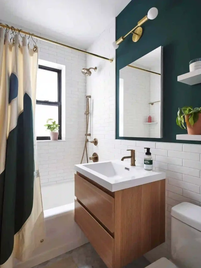 small bathroom design with teal wall, shower curtain, mirror and cabinet