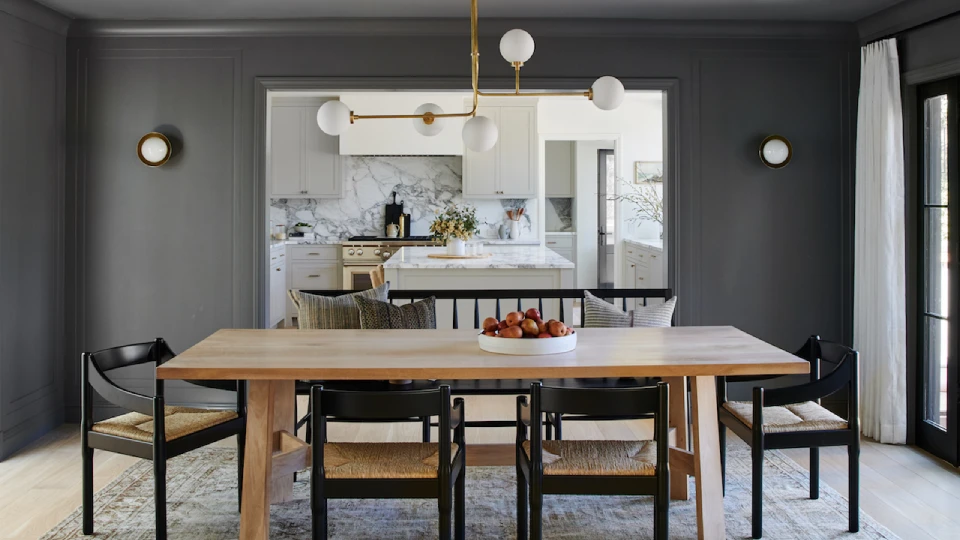 Grey coloured dining offset by wooden furniture 