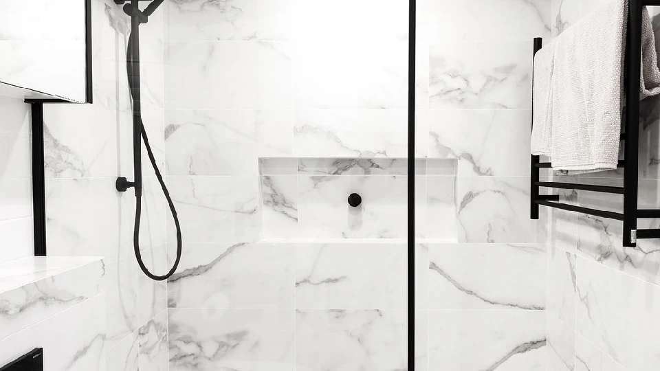 white shower with mirror, washbasin, fixtures and fittings