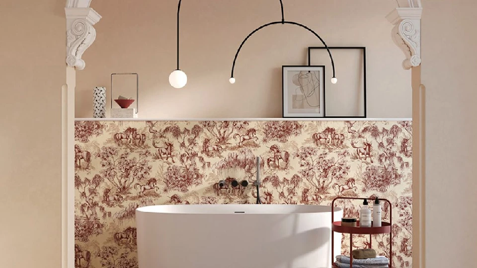 beige bath space with floral wall tiles with bathtub, pendant lights and table