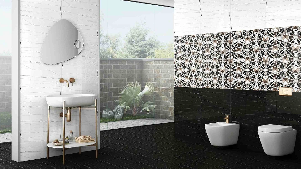 black floor tiles in a bathroom with mirror, toilet, washbasin