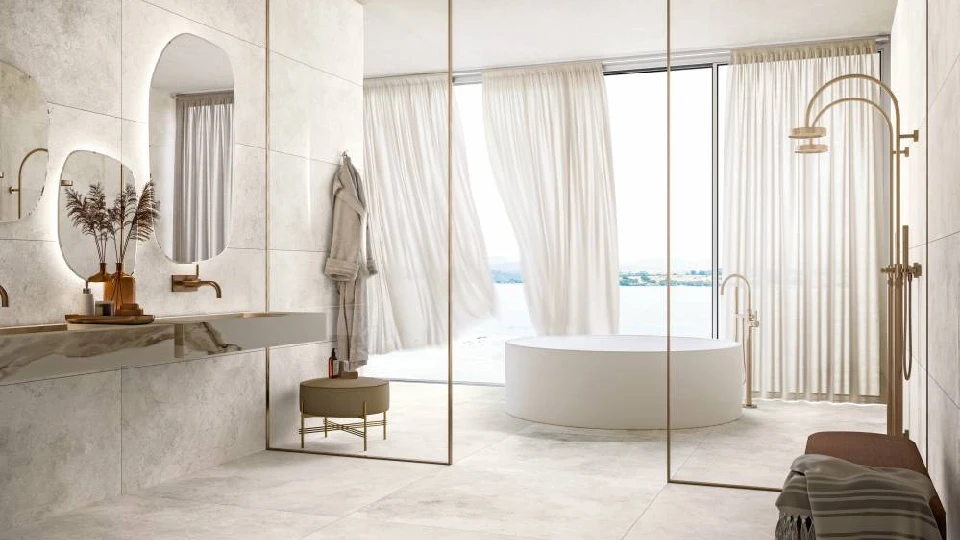 beige bath space with white bathtub, washbasin, mirror with light and a shower