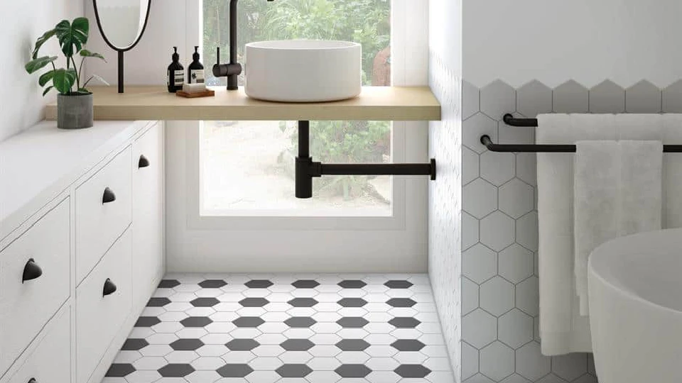 black and white flooring in a bathroom with white basin