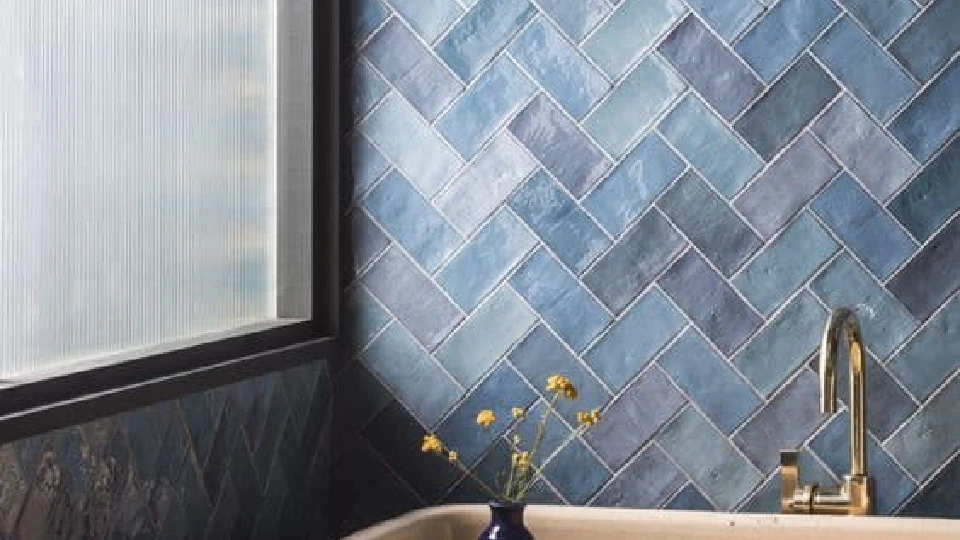 Blue bathroom with yellow flowers in a small vase