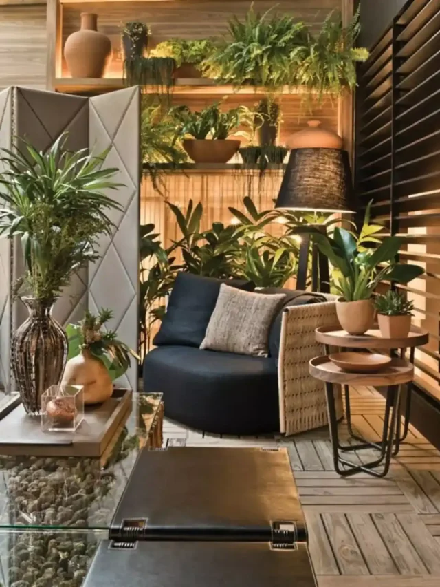 biophilic living room with indoor plants, navy blue coloured chair