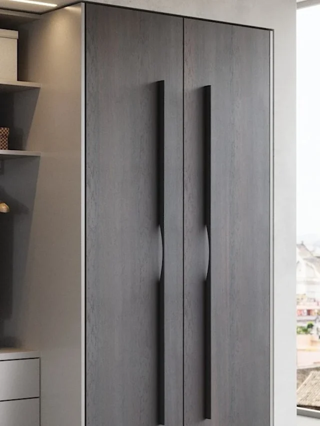 a grey wardrobe with handles