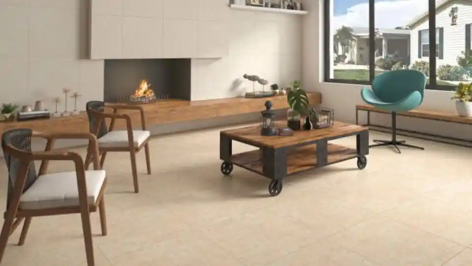 Matt tiles in a living room with 2 chairs, rectangular table and a fire place