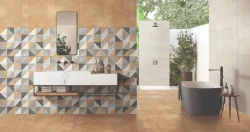 Mosaic tiles in grey, brown, cream and black colours in triangular shapes