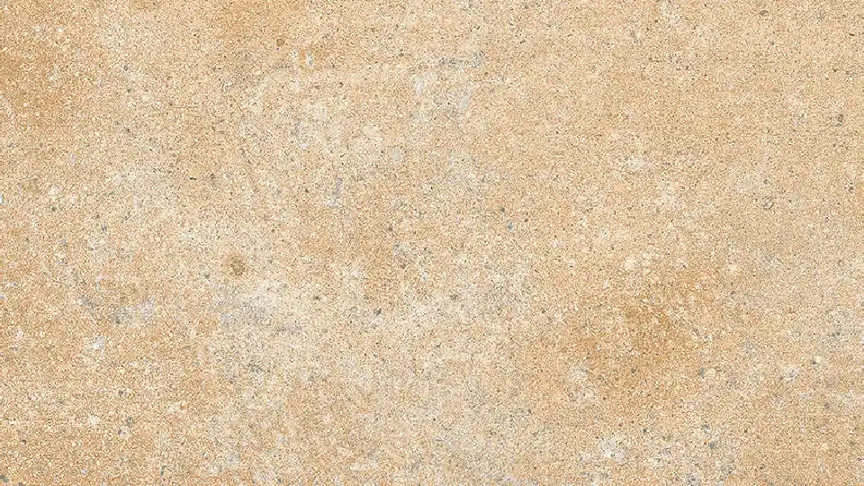 close-up view of a beige tile with beach sand like look