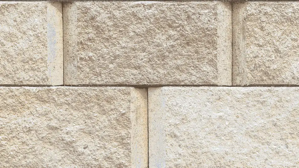 close-up view of exterior rock tiles , beige rectangular blocks arranged in a bond pattern