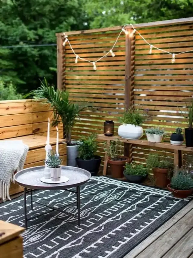 outdoor patio with wooden seating and fairy lights