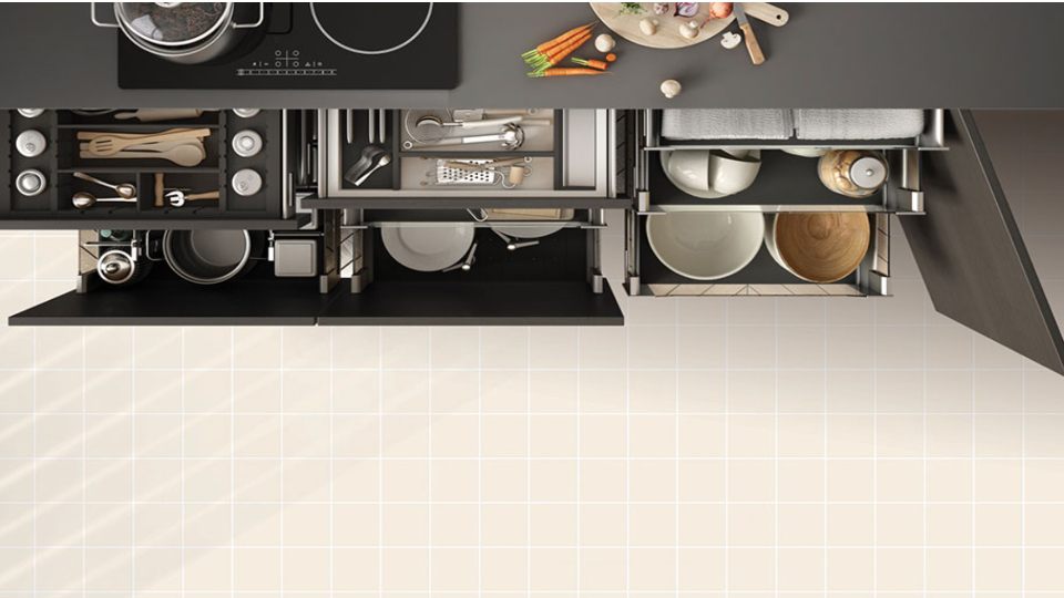 kitchen with tandem boxes filled with cutleries, vegetables on the kitchen slab with a pot on the stove