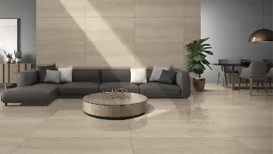 matt tiles in a living room setting. dark grey sofa with round table
