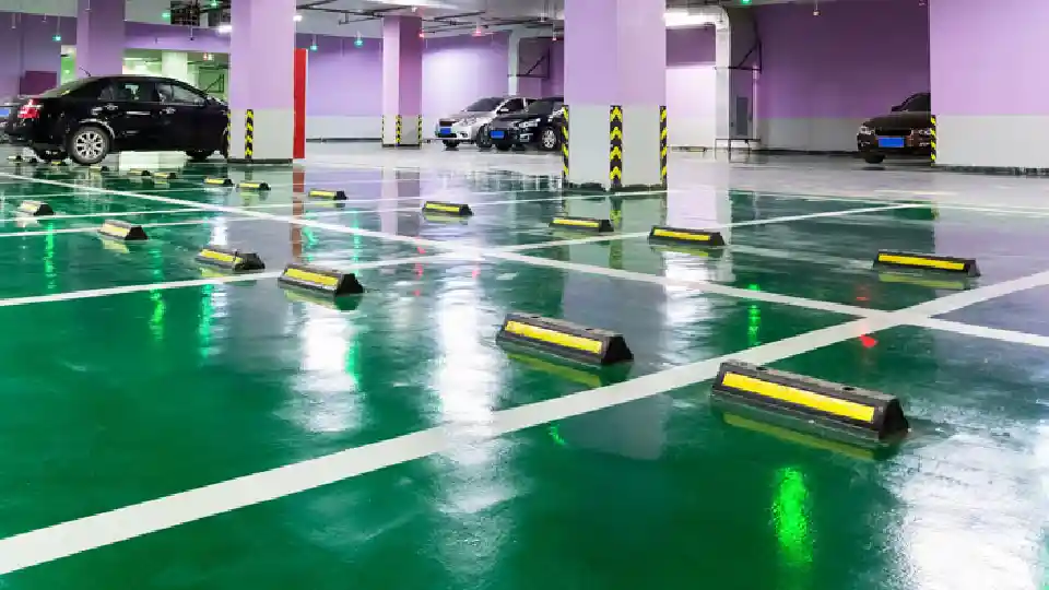 green flooring in parking lot with a few cars parked, epoxy flooring price per square foot