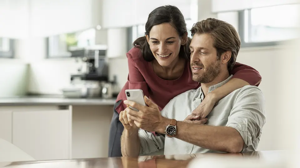 a couple with Siebel Eltron products in the background