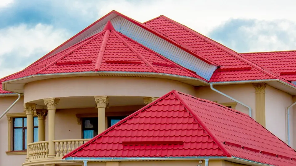 Red fibre cement coated roofing on a house