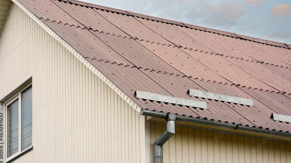 Asbestos cement sheet on house