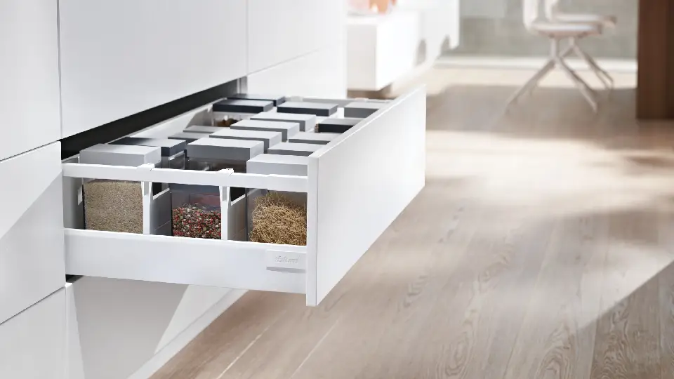 white kitchen drawer in a kitchen with brown wooden floors