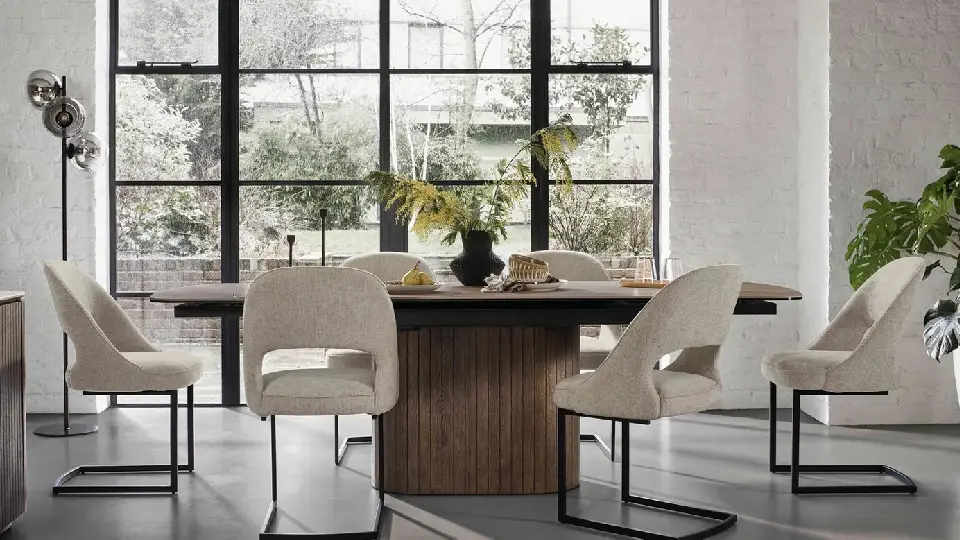 white dining room with tables, chairs and large window