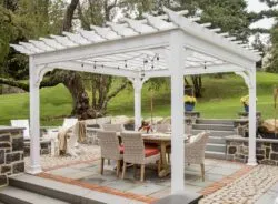 white outdoor pergola with outdoor garden furniture
