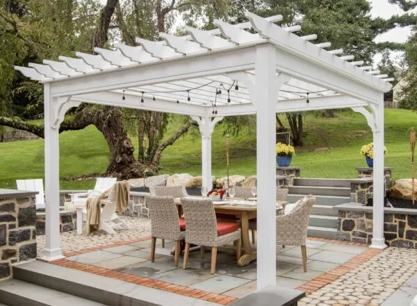 white outdoor pergola with outdoor garden furniture