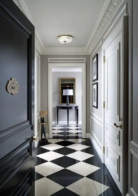 white POP false ceiling with cornices for lobby with black and white walls and check-patterned flooring