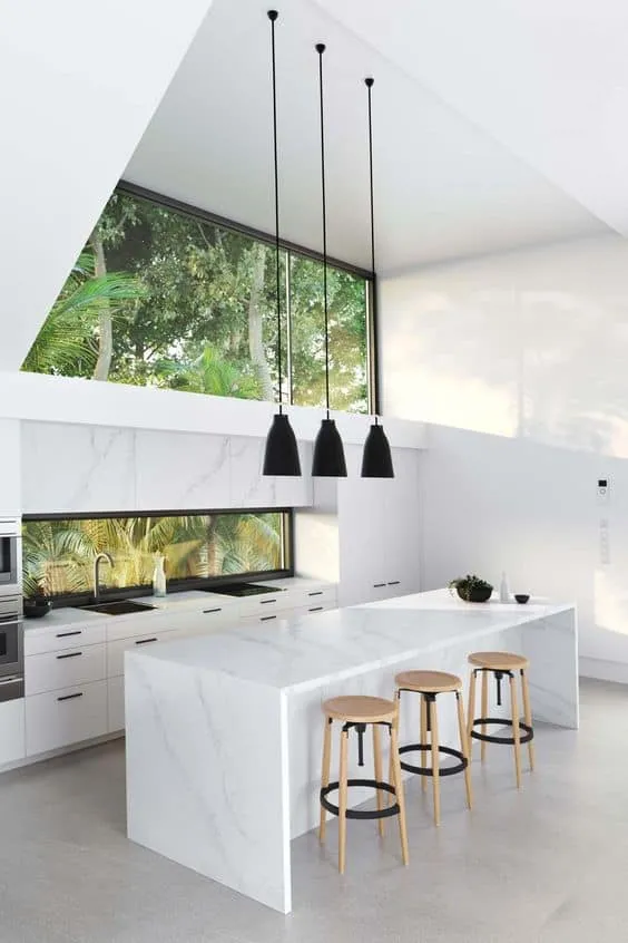 smooth marble surface with high walls and black pendant lights