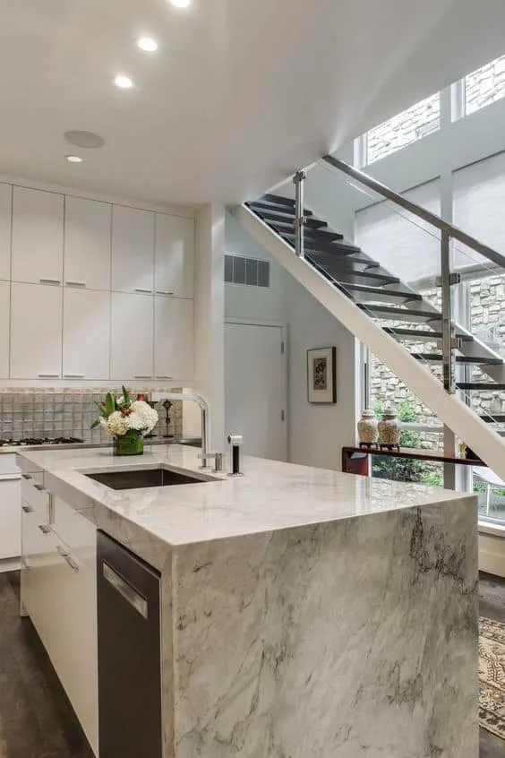 textured quartzite countertop for an open kitchen with adjacent staircase