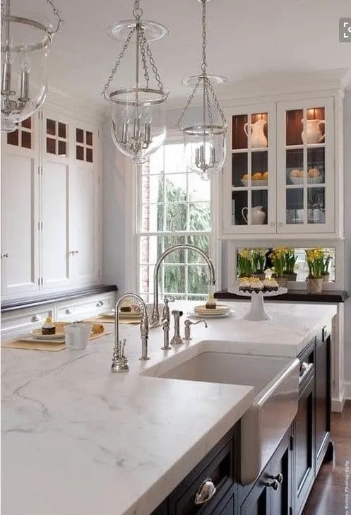 white quartzite countertop for a white spacious kitchen 