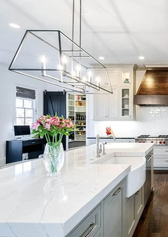 white quartz kitchen countertop designs with ceiling lights in a modular kitchen