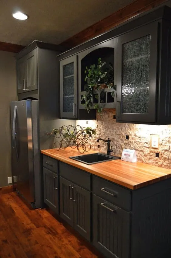 wooden countertop with black cabinets and drawers for a kitchen. 