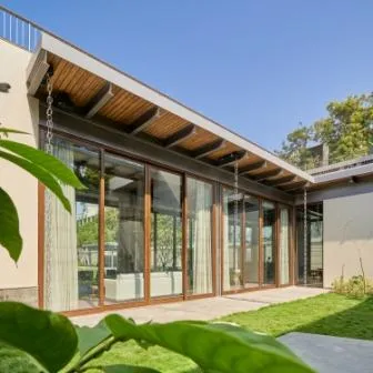 Wood shade with glass walls for sustainability in living