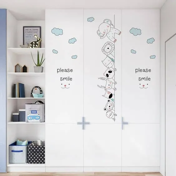 white wardrobe designs with comic wallpapers and drawers