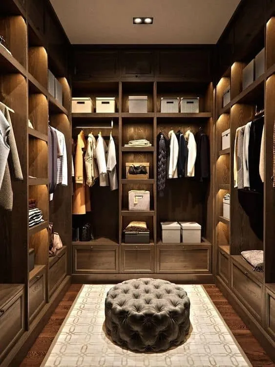 walk in wardrobe designs with a centre round sitting area.