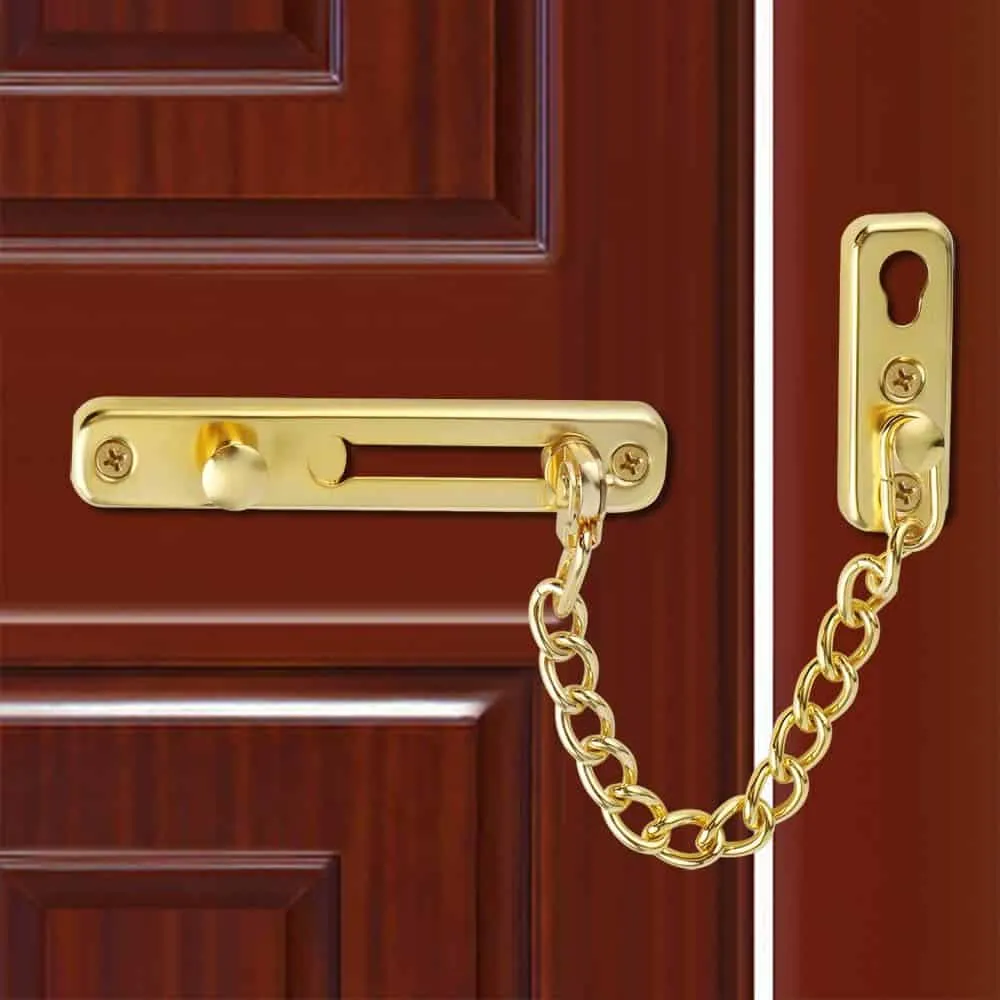 golden chain door lock on brown door