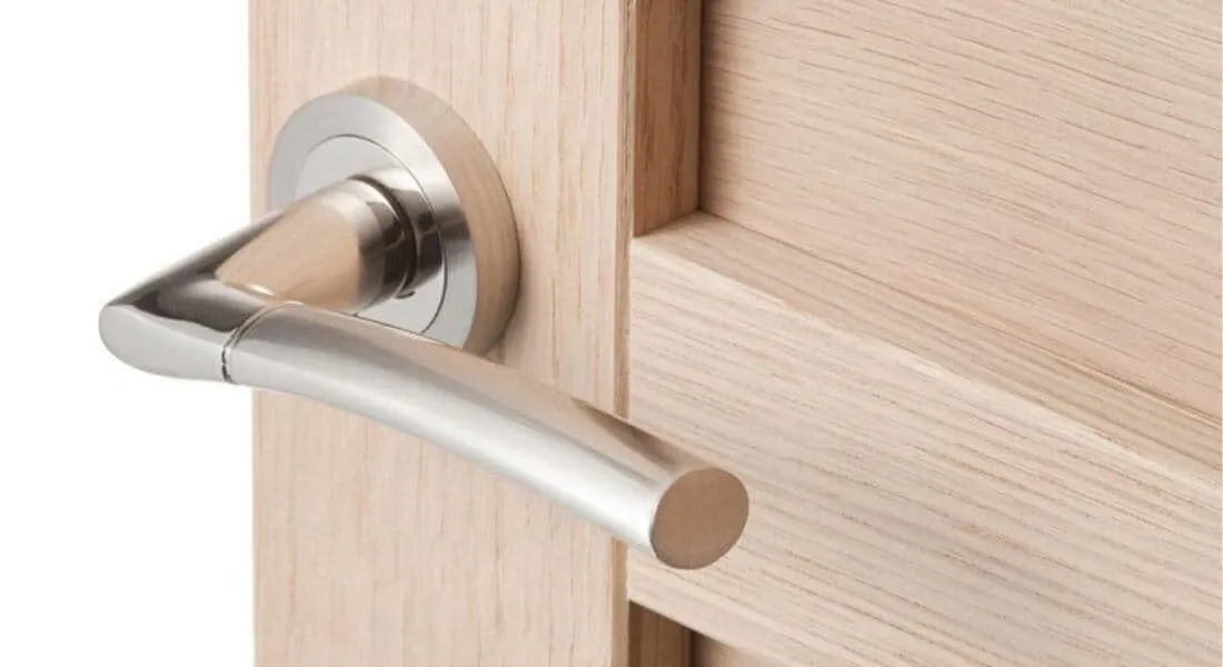 silver lever handle door lock on round rose