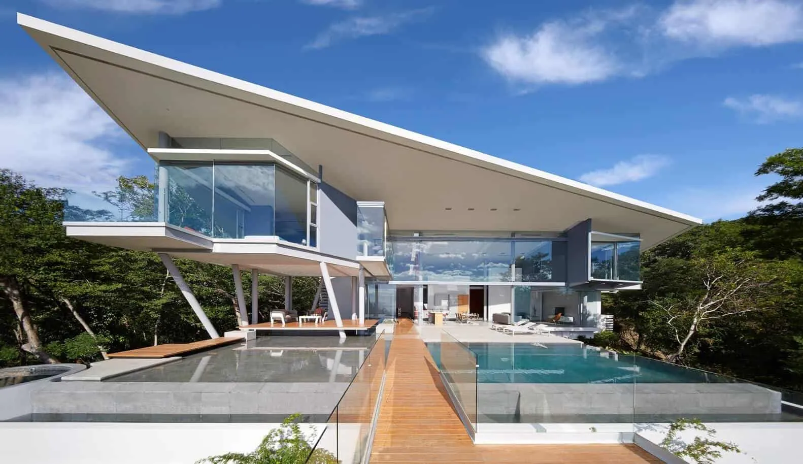 modern home design with a slant roof and glass walls