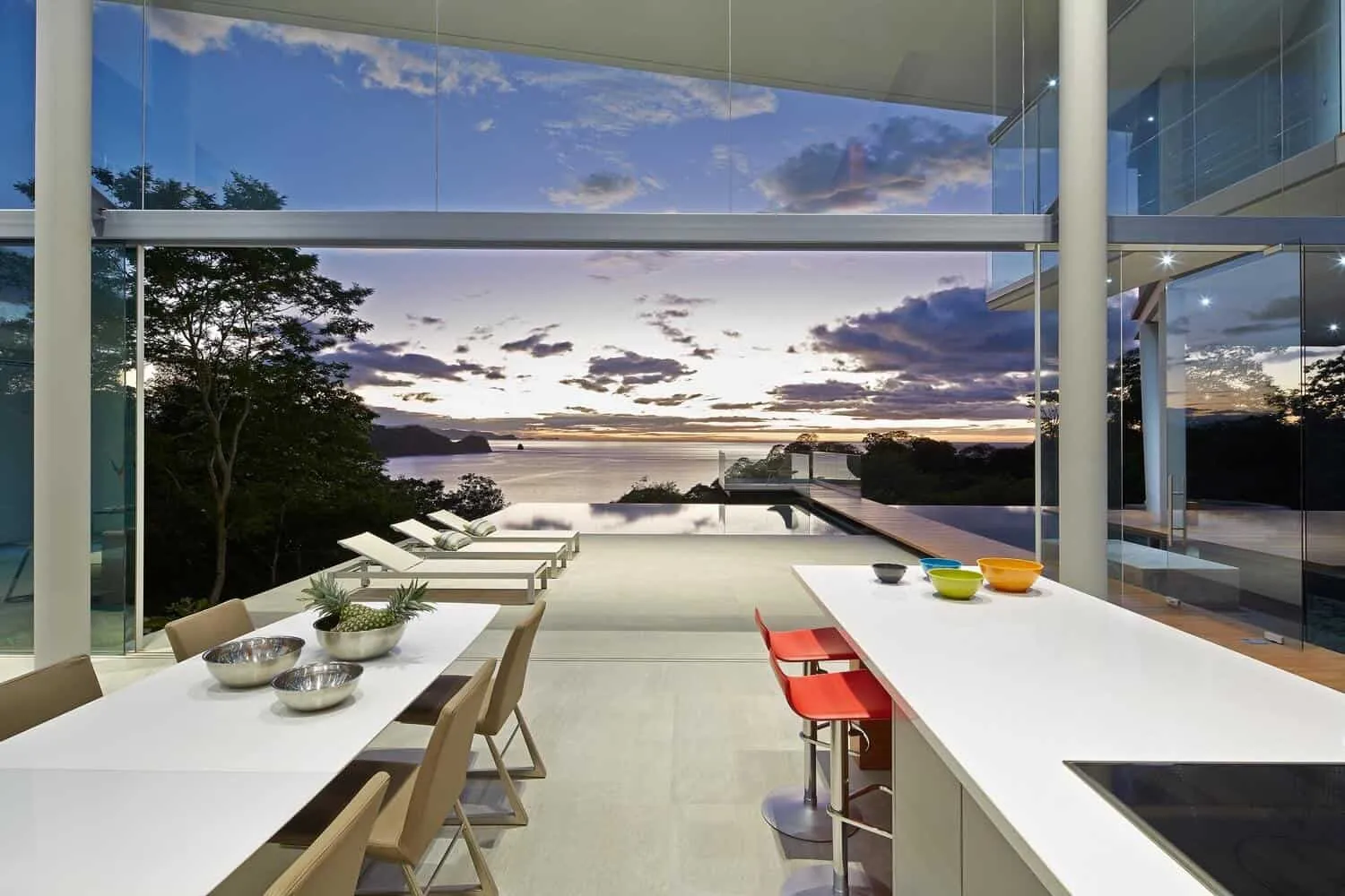 outdoor seating area with overhead panel and pool view