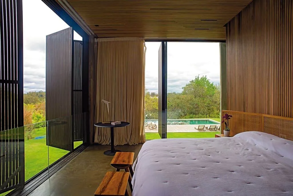 bedroom design with tall wooden windows