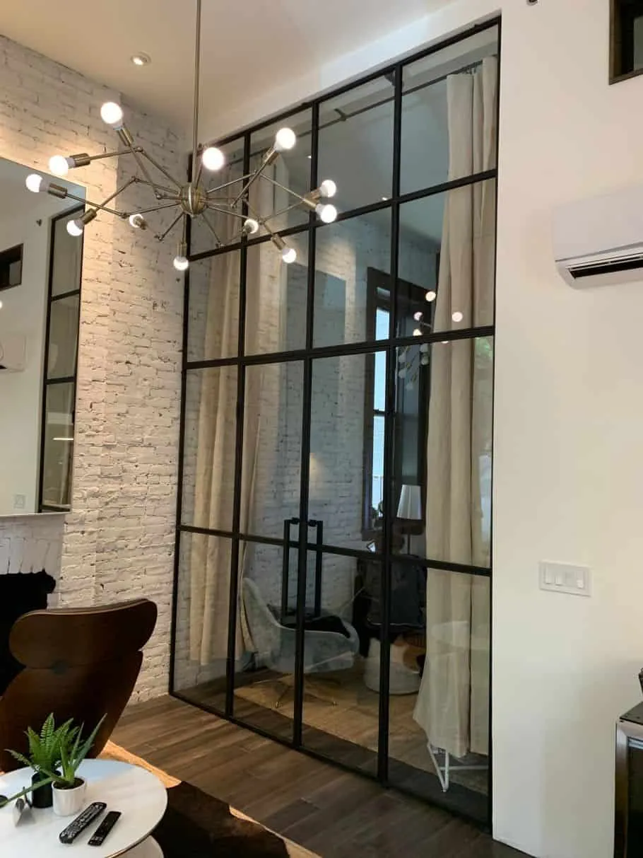glass partition wall design with black metal frames