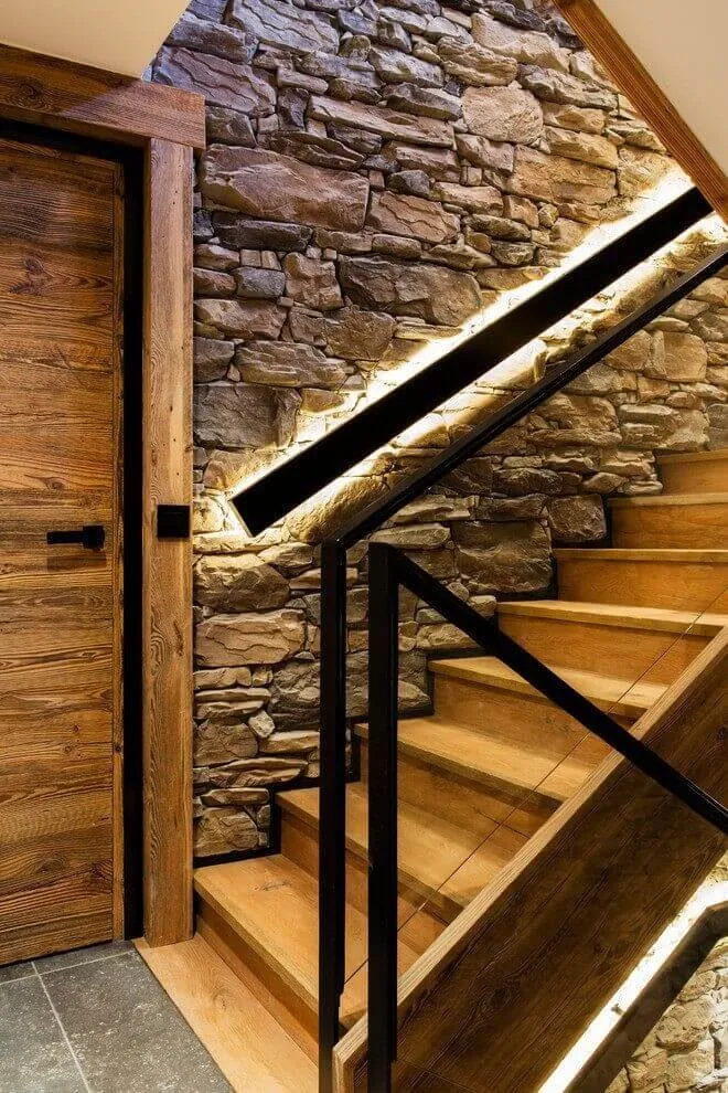 Mixed stone and wood wall by the stairway