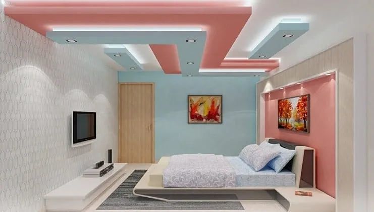 peach and blue bedroom false ceiling with concealed lighting
