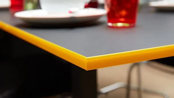 black table with yellow furniture fittings